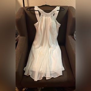 Scarlet brand flowy cocktail mini dress with gorgeous embellished neckline!